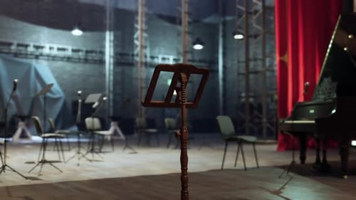 Old Opera Stage Setting with Music Stand Chairs and Grand Piano