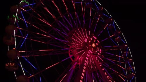 Ferris Wheel During Night Time At The Amusement Park