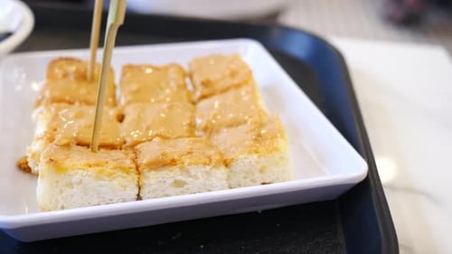 Peanut Butter Toast Being Skewered