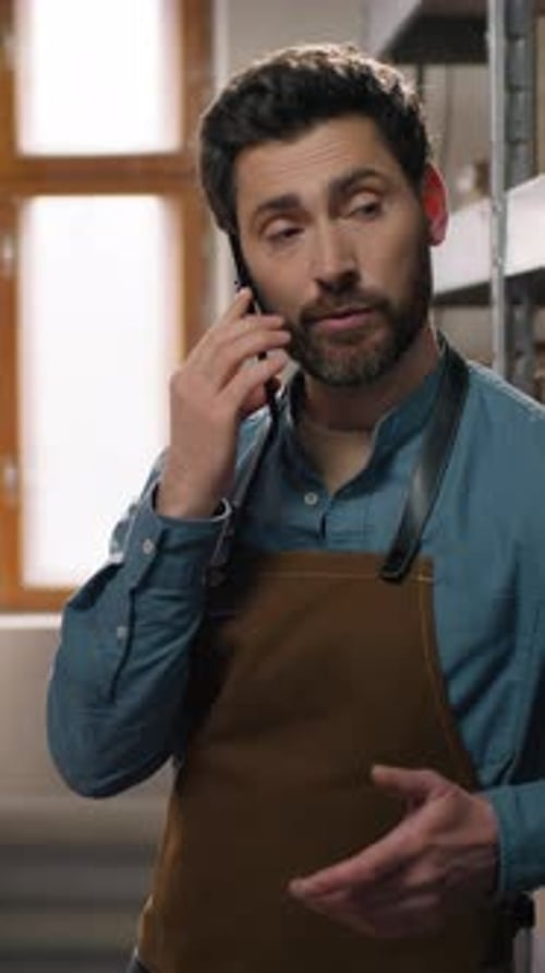 Coffee Factory Caucasian Man Small Business Owner Male Talking Mobile Phone Inspecting Shelf