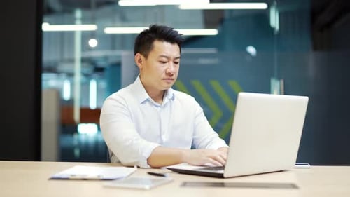 Difficulties are problem working with software on a laptop business man employee entrepreneur office