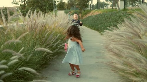 Latino children brothers friends cousins playing and enjoying fun running