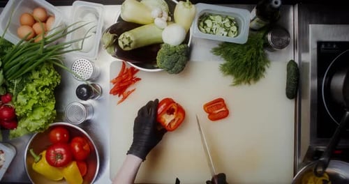 Cutting Fresh Red Pepper in Commercial Kitchen