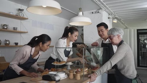 Entrepreneur and team are working at bakery and coffee shop.