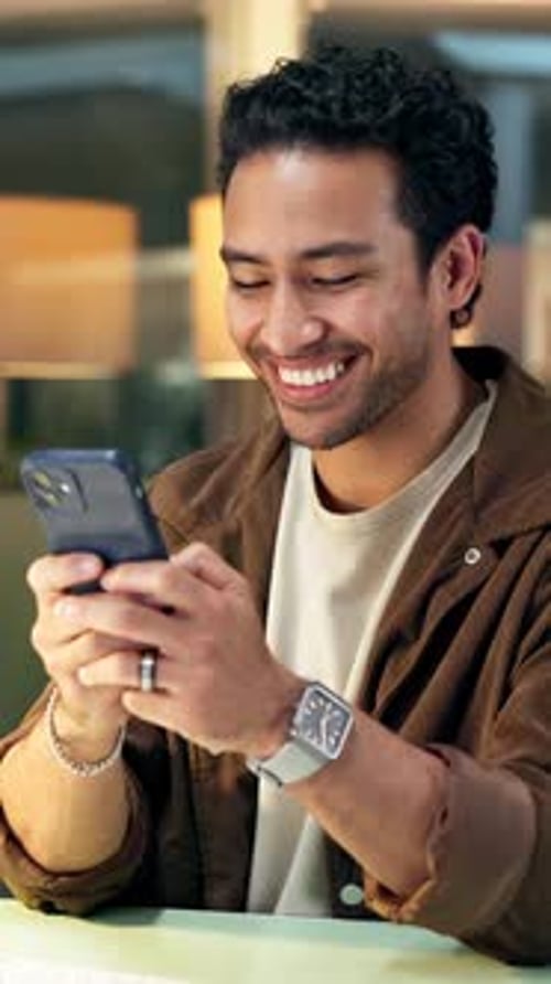 Man, phone and typing in office at night for message, feedback and review funny article