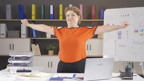 Businesswoman exercising in the office.