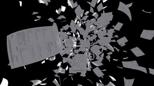 Explosion of flying papers on black background