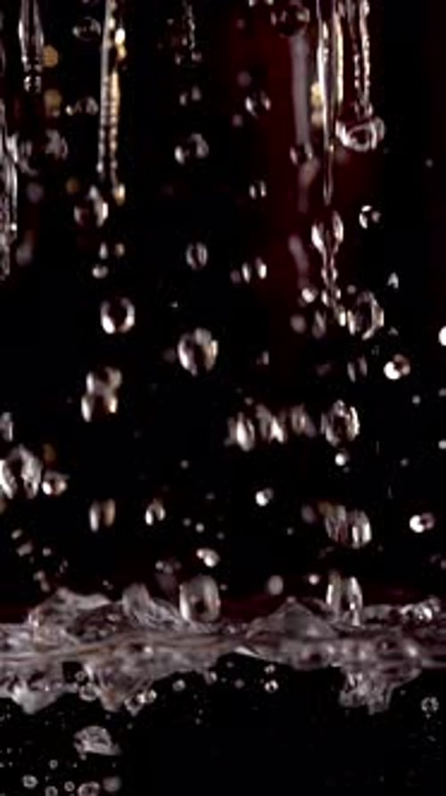 Slow Motion Water Pouring on Black Background Vertical Video