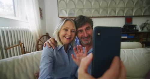 Couple Video Chatting at Home With Smartphone