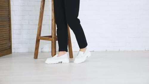 Woman in Stylish White Platform Loafers Posing