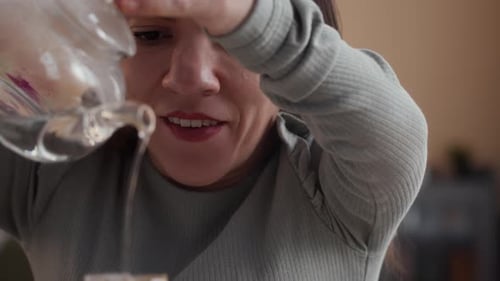 Woman Pouring Hot Water for Pour-Over Coffee