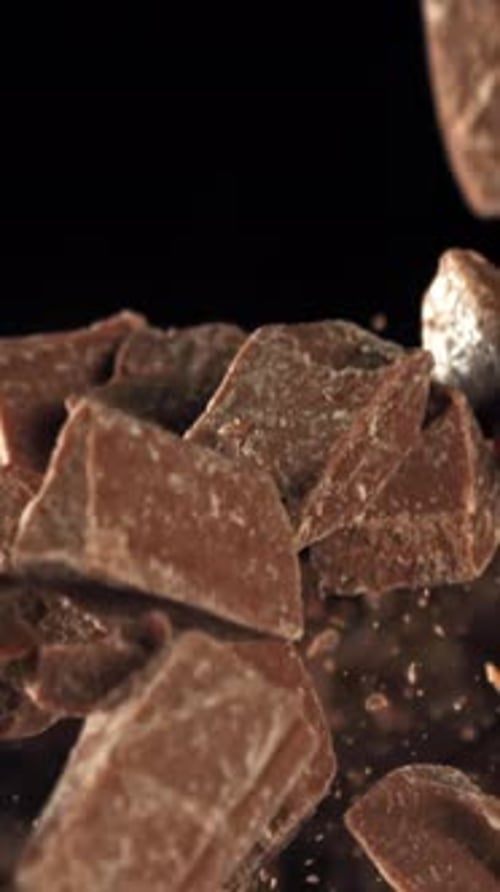 Pieces of Chocolate Fly Up and Fall Down Filmed on a Highspeed Camera at 1000 Fps