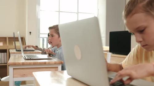 Smart boy using laptop to generated AI by coding engineering prompt. Pedagogy.