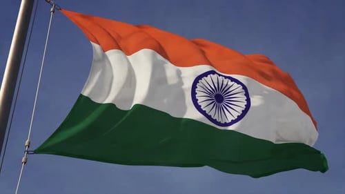 Dynamic Indian Flag Waving Against Blue Sky