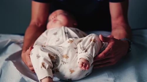 Infant Receiving Care on Examination Table in Hospital