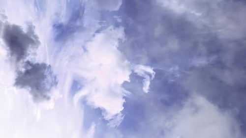 Moving clouds hovered over the blue sky
