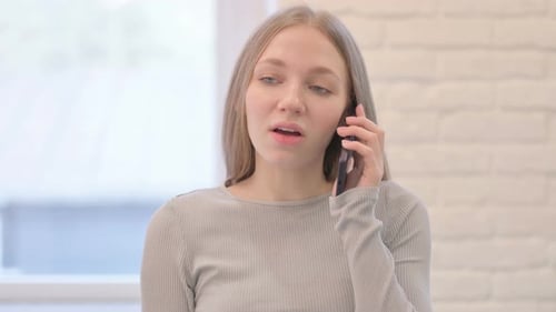 Woman Talking on Cell Phone Close Up Indoors