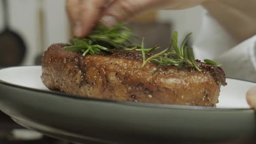 Juicy Steak Topped With Fresh Rosemary