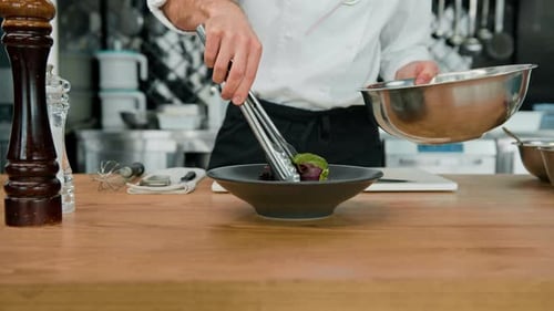 Chef Plates Salad in Commercial Kitchen