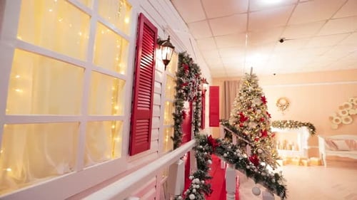 Decor of the porch with Christmas ornaments. Beautifully decorated photo studio for festive footage.