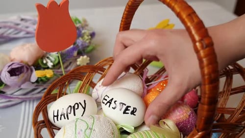 Decorating Easter Eggs in a Wicker Basket