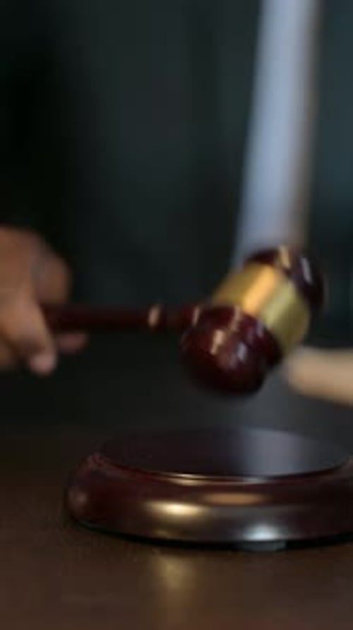 Close Up of African Judge Striking Gavel, Pronouncing Sentence, Vertical Video