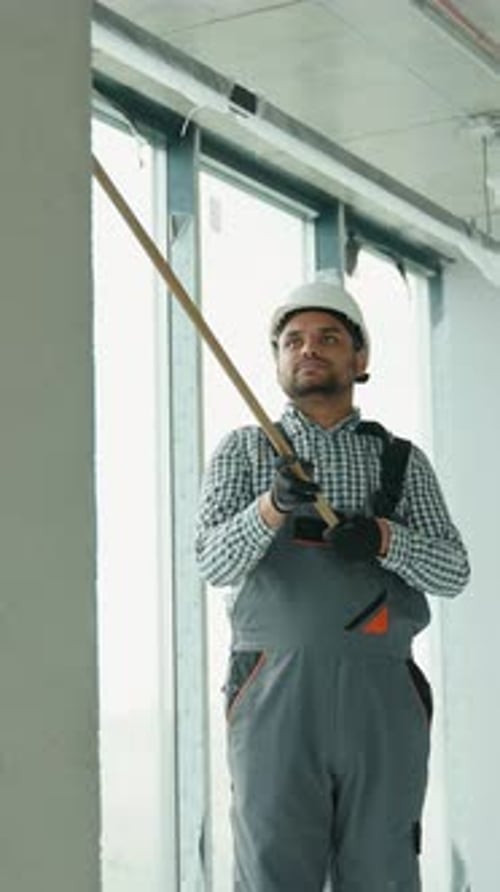 Indian Painter Painting a Wall in Office Vertical Video