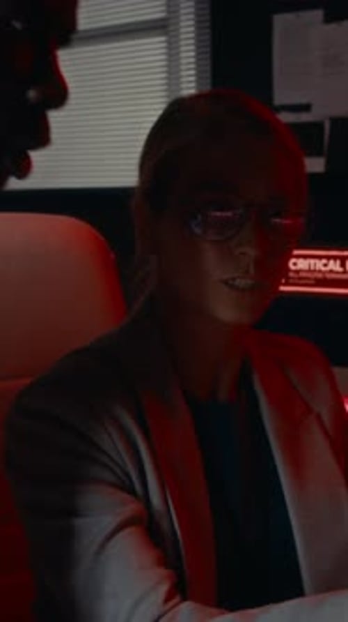 Business Colleagues Working Late at Computer