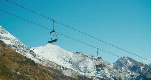 Empty Working Ski Lift at Mountain Landscape on Ski Resort in Spring or Autumn