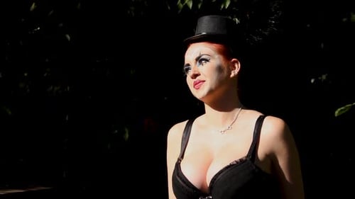 Woman Dancing with Red Hair Wearing Eye Makeup