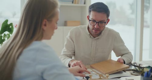 Interior Designers Working At Desk In Office Planning Interior Design
