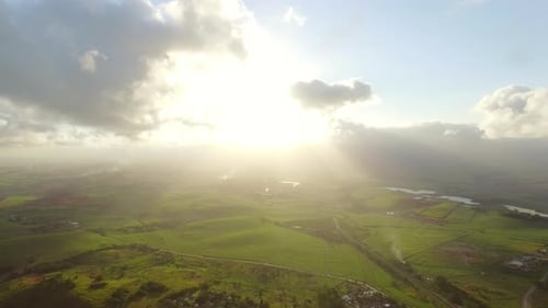 Magical aerial view of african mountain agriculture farmland landscape at sunset