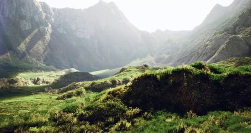 Majestic Mountain Landscape with Lush Greenery and Rocky Terrain in Daylight
