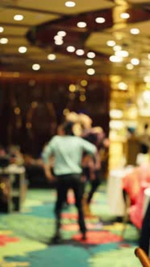 Blurred People Dancing at a Party at Night