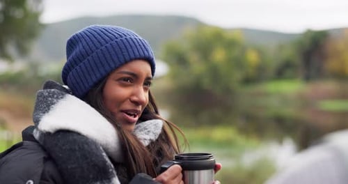 Friends Enjoying Hot Beverage in Nature