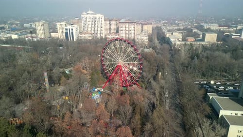 Bishkek Ferris Wheel at Panfilov Park, drone rotation left shot