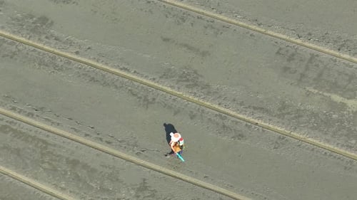Aerial View of Farmer Walking in Field