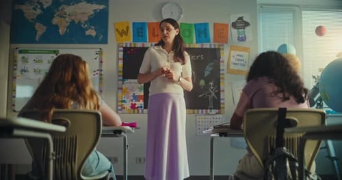 Dolly Shot of Female Teacher Starting Lesson Teaching Ecology to Primary School Children in
