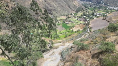 Aerial dolly drone shot from a valley in matacuna lima in peru with a beautiful view of a village wi