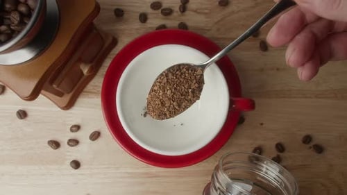 Adding Instant Coffee To a Cup