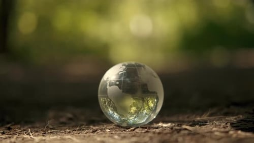 Hands Cupping Globe outside in Nature