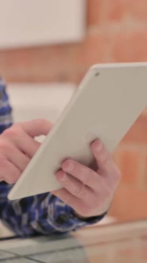 Close up of Man Hand Using Tablet PC, vertical video