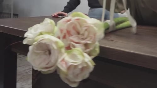 Flower Shop – Girl Florist Making a Bouquet.