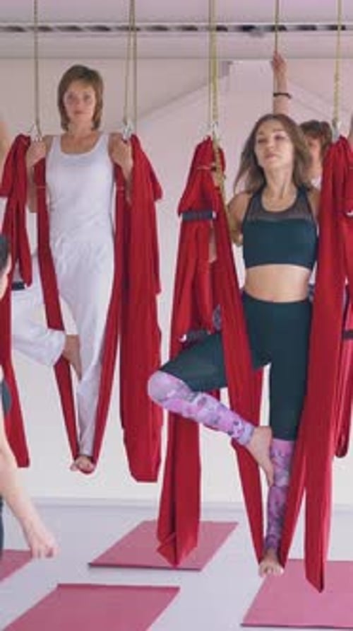 Women doing Aerial Yoga in Fitness Class