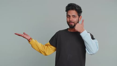 Indian Man Showing Thumbs Up Pointing Empty Place Advertising Area for Commercial Text Copy Space