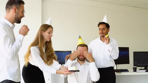 Young Office Worker is Blow Candles on Cake and Make a Wish While Celebrating Birthday with