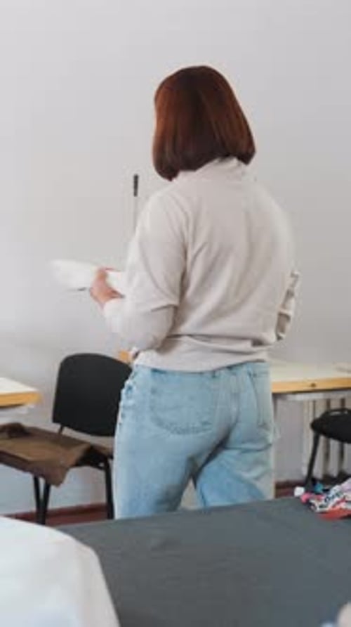 Fashion Enthusiast Organizing Materials in Cozy Shop Caucasian Craftsperson Meticulously Setting Up