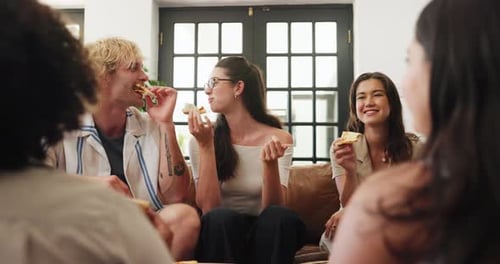 Friends Enjoying Pizza Together While Sitting on Couch
