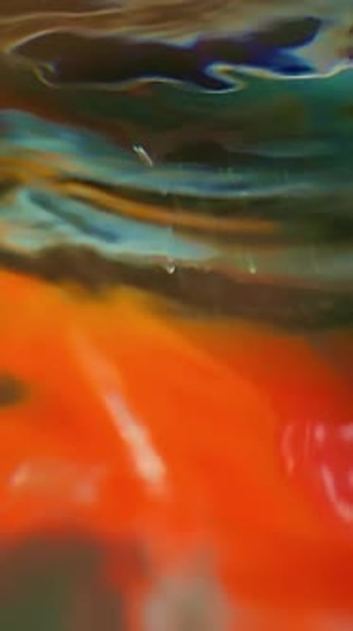 Abstract colors of swirling paint, water, and liquids