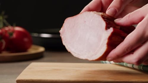 Woman Slices Ham Bacon Meat Thick Pieces on a Wooden Board Beef or Pork Jamon Chef Cooking Breakfast